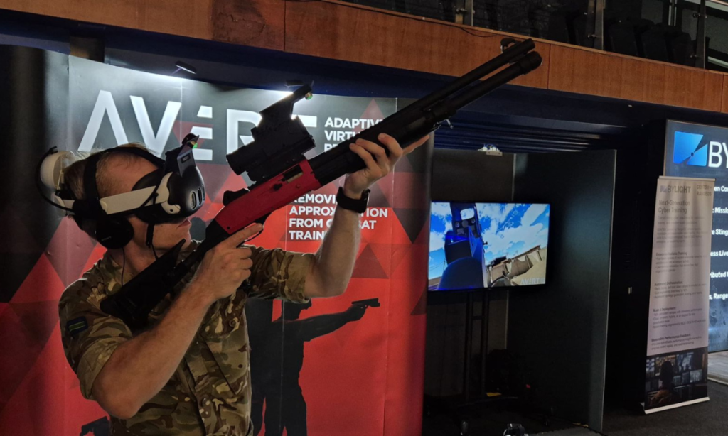 Military VR trainee engaging an aerial drone threat using AVRT Counter-UAS training system