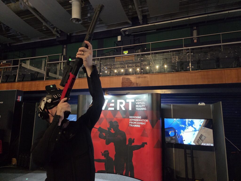 Military VR trainee engaging an aerial drone threat using AVRT Counter-UAS training system