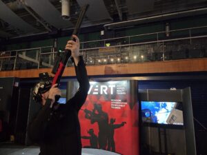 Military VR trainee engaging an aerial drone threat using AVRT Counter-UAS training system
